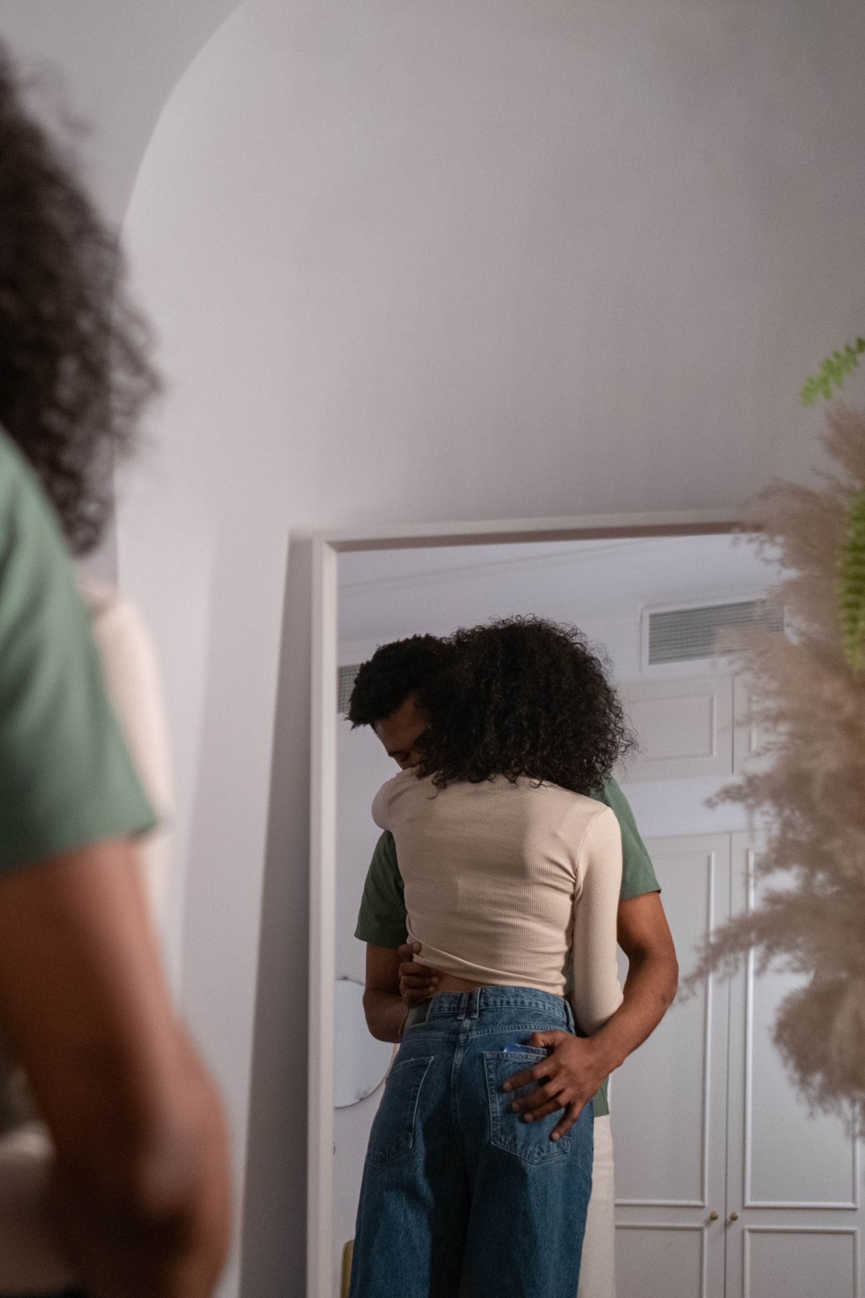 A couple sharing a warm, close embrace after a difficult moment