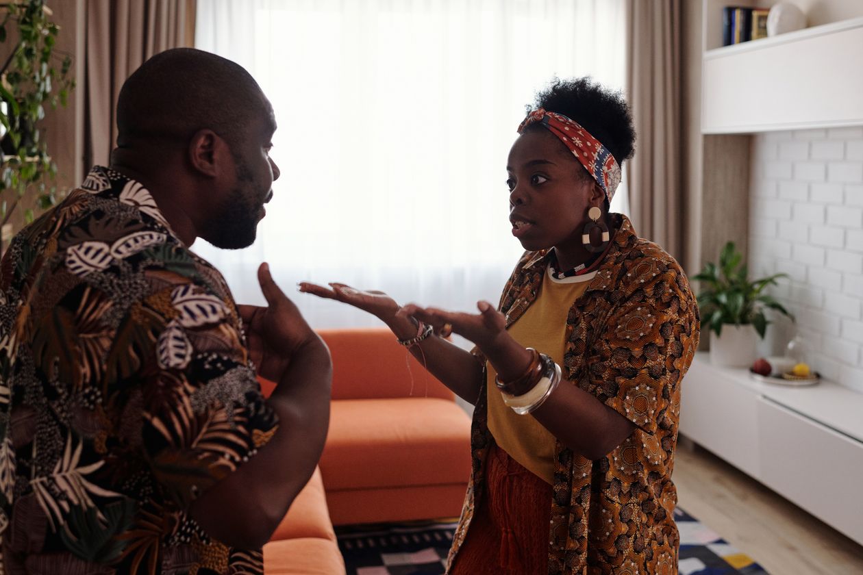 A couple in the middle of a heated argument in their living room