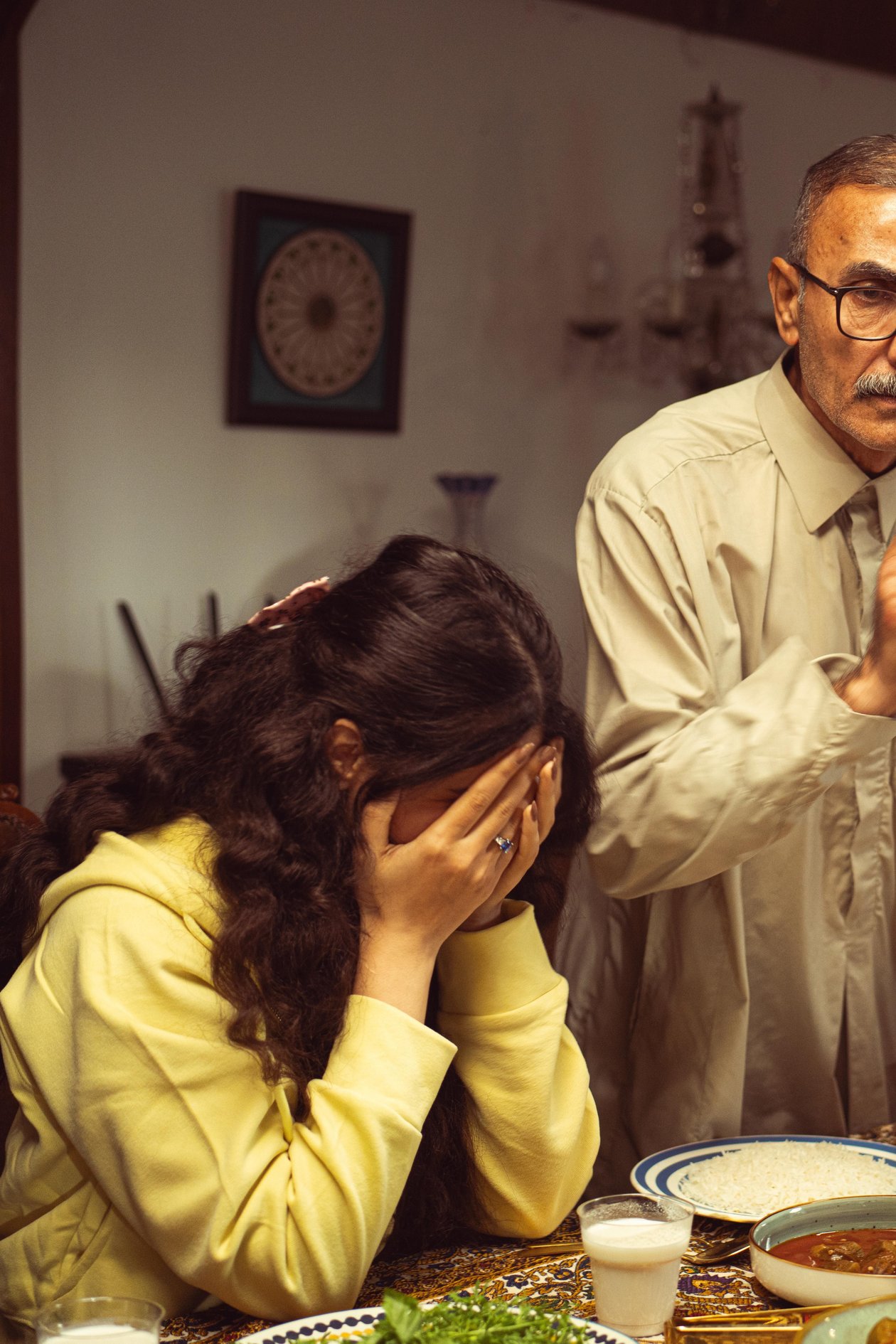 A tense moment between family members during a gathering