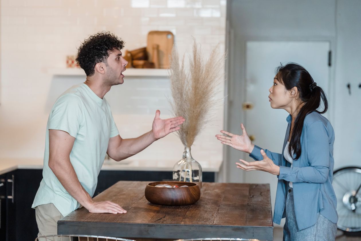 A couple in a heated argument at a table
